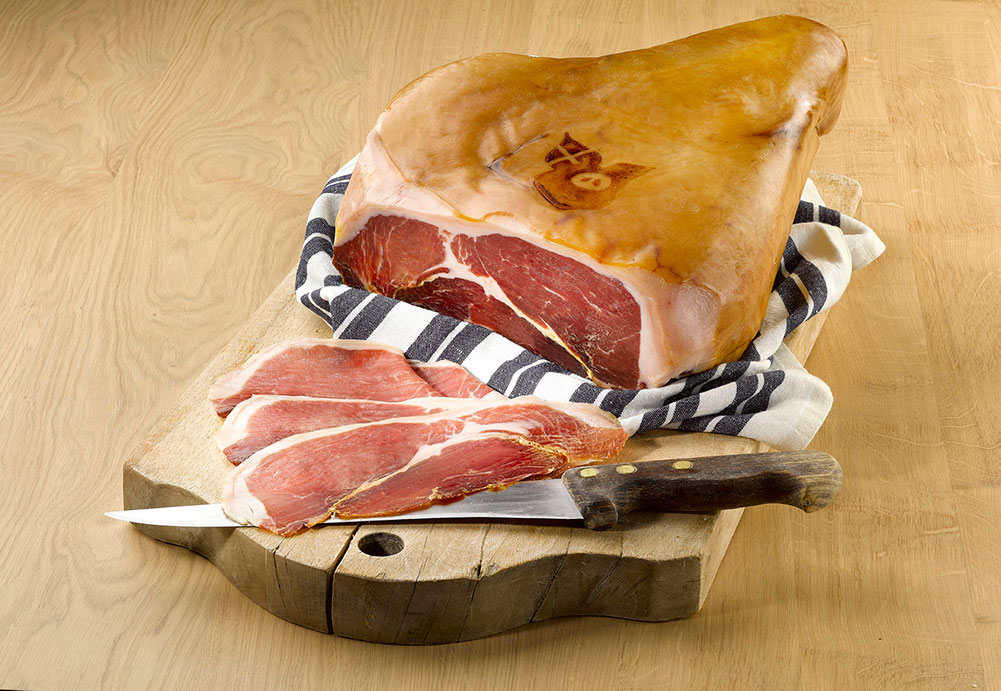 Rougeot du Charvin® Savoie cured ham sliced on a chopping board