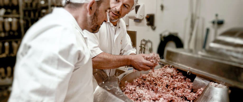 Christian Favre checks the meat processed by the cutter
