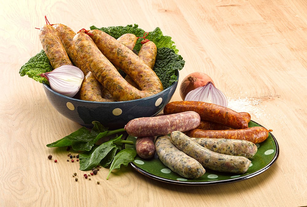 Bowl and plate of diots, pormoniers, cabbage sausages